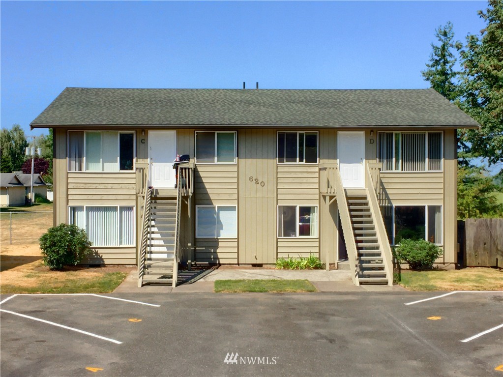 620 Everson Road, Unit 18 Everson, WA 98247 - Photo 3 of 14 a front view of a house with a yard and garage