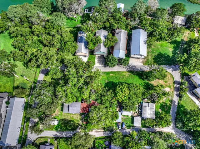 a view of a city with lush green forest
