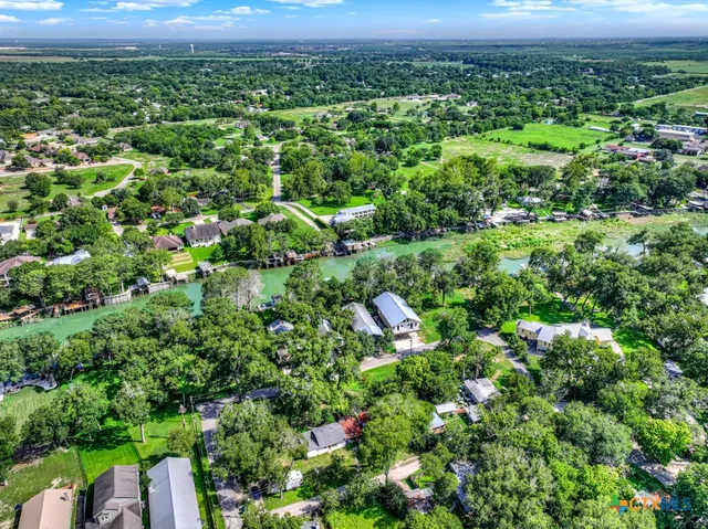 an aerial view of house with swimming pool