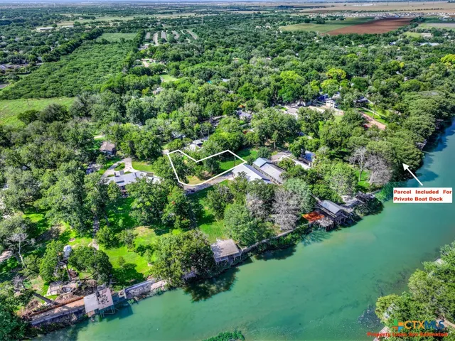 a view of a city with lots of trees in the background