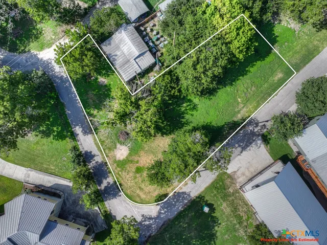 an aerial view of a house with pool outdoor seating and yard