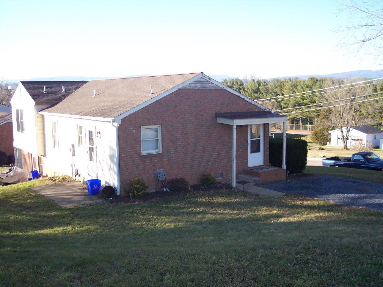 275 Summit Street Dayton, VA 22821 - Photo 1 of 1 a backyard of a house with table and chairs
