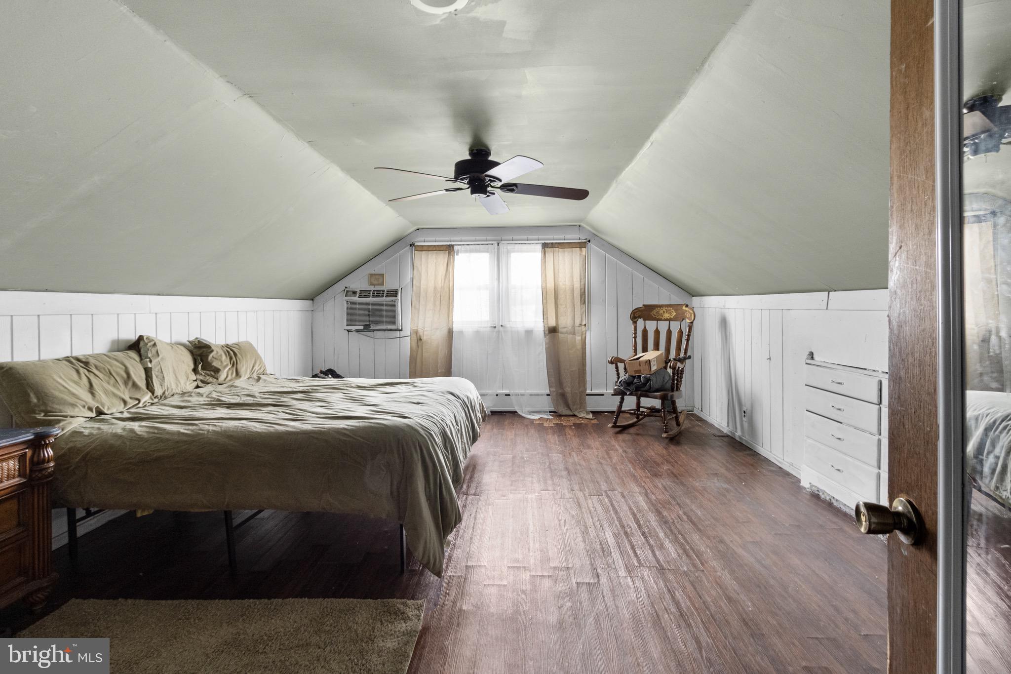 61 Franklin Avenue Clementon, NJ 08021 - Photo 11 of 32 a bed room with a bed and a chair