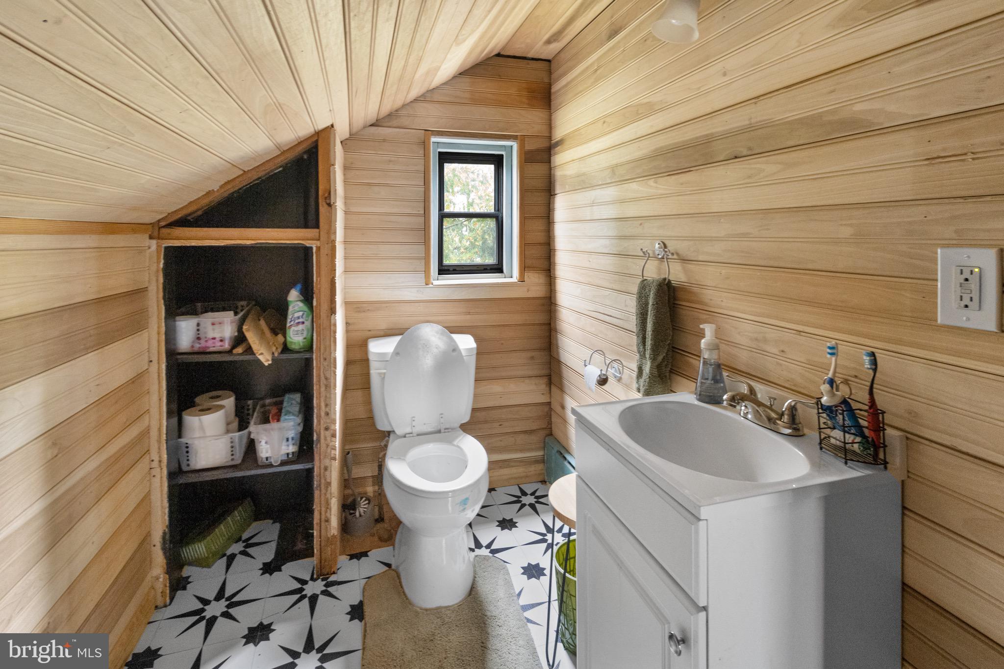 61 Franklin Avenue Clementon, NJ 08021 - Photo 12 of 32 a bathroom with a sink a toilet and a mirror