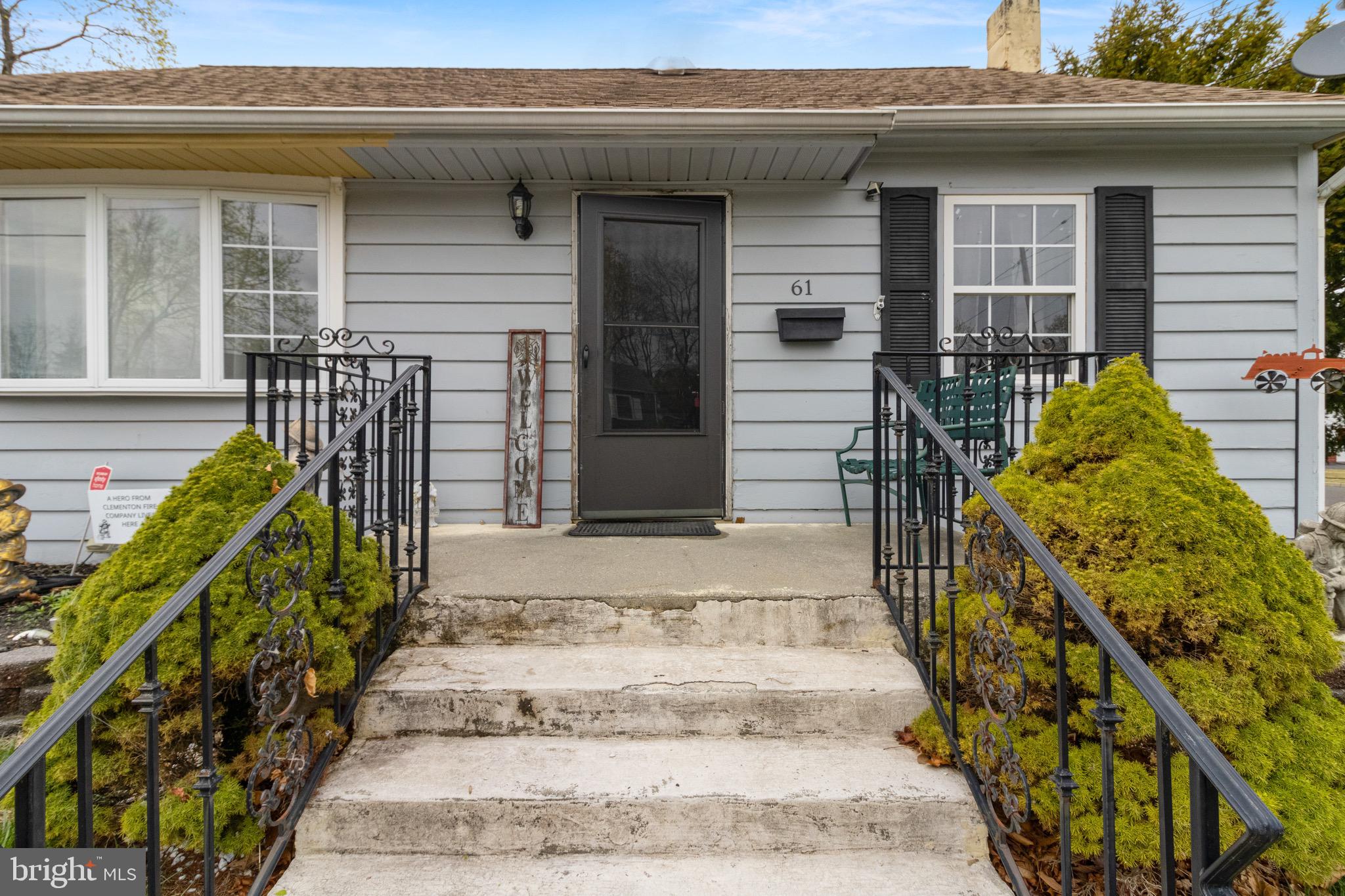 61 Franklin Avenue Clementon, NJ 08021 - Photo 6 of 32 a front view of a house with a garden