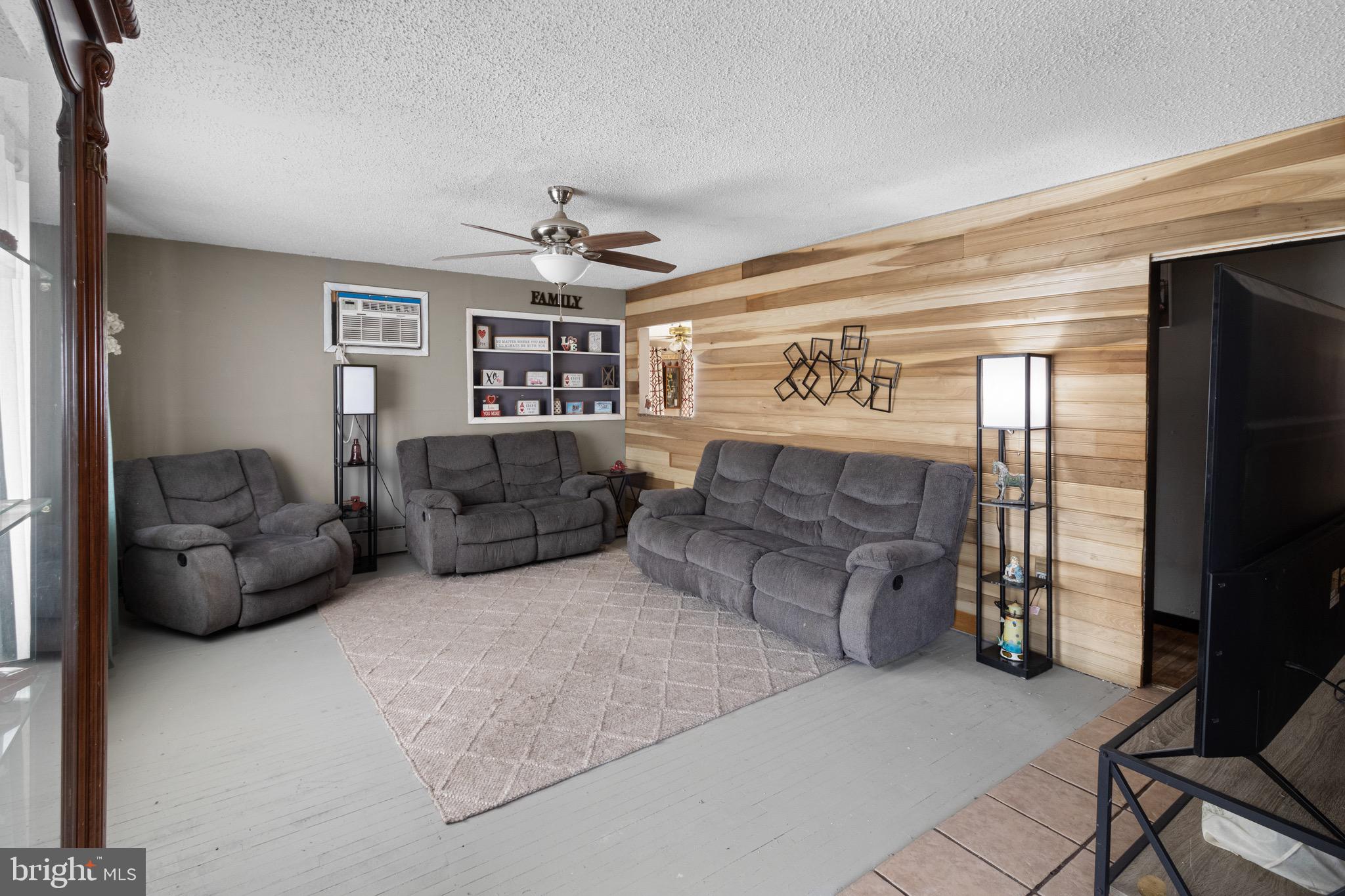 61 Franklin Avenue Clementon, NJ 08021 - Photo 7 of 32 a living room with furniture and a flat screen tv
