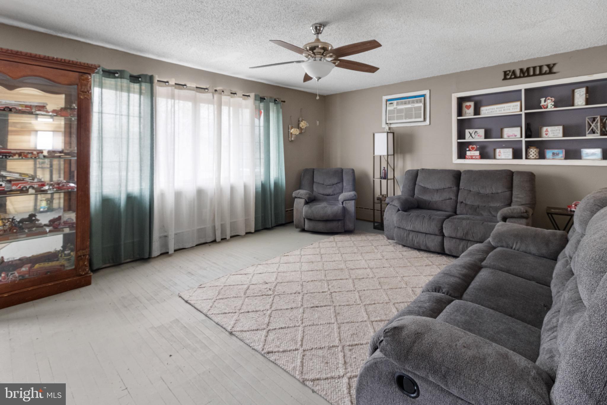 61 Franklin Avenue Clementon, NJ 08021 - Photo 9 of 32 a living room with furniture and a window