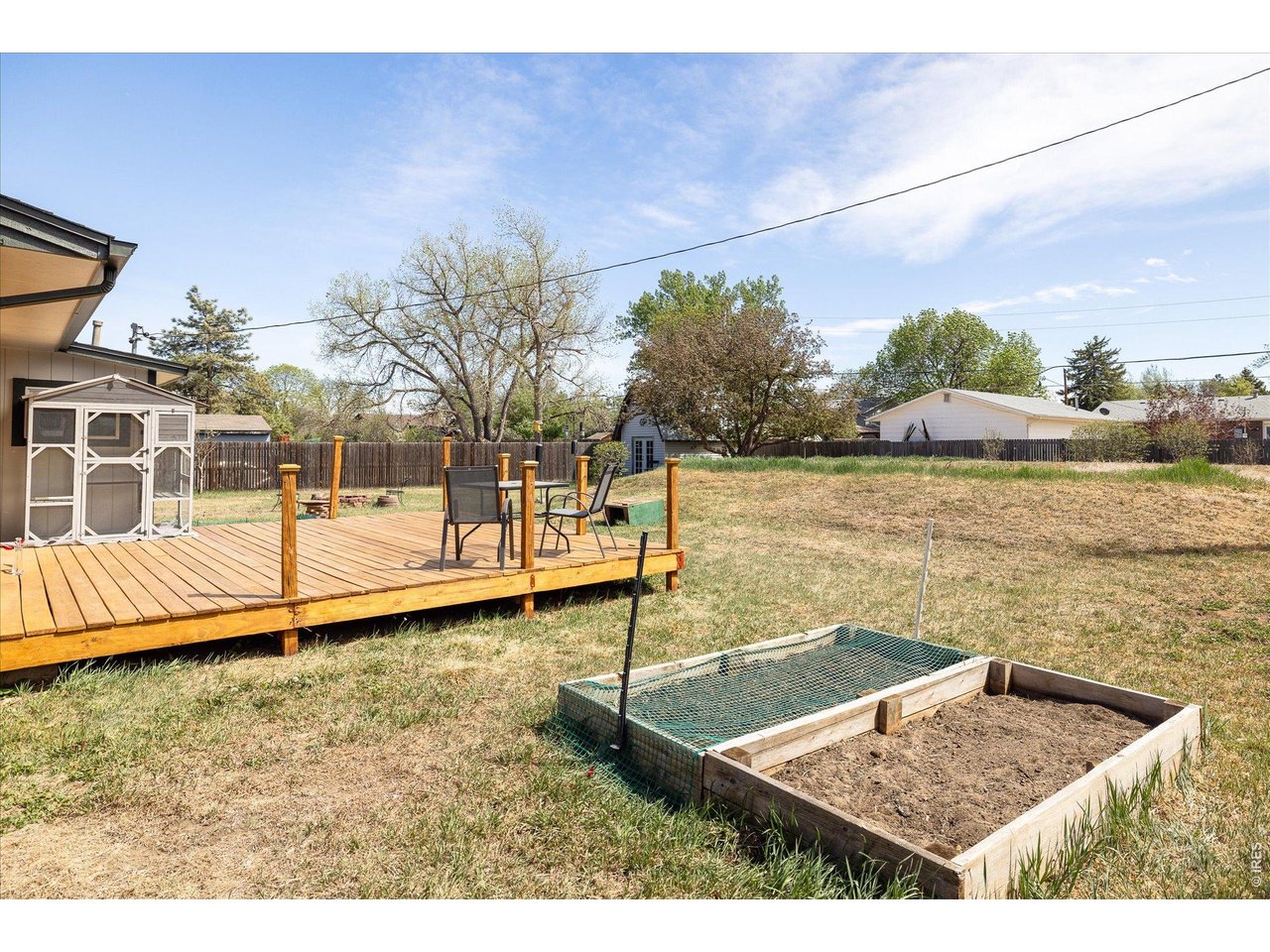 9234 Arapahoe Road Boulder, CO 80303 - Photo 28 of 37 sunny deck overlooks raised garden beds, ideal for outdoor dining and home gardening