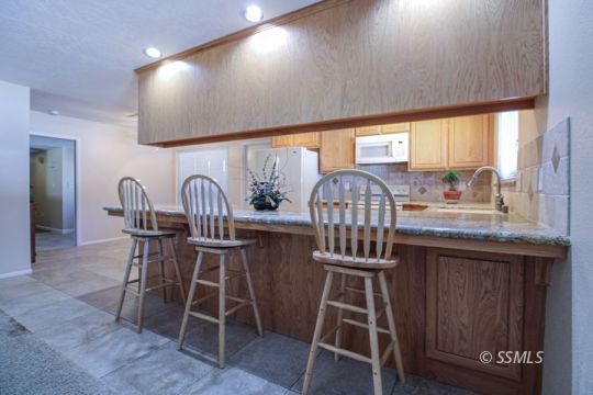 516 Randall Street Ridgecrest, CA 93555 - Photo 13 of 50 a dining room with furniture and wooden floor