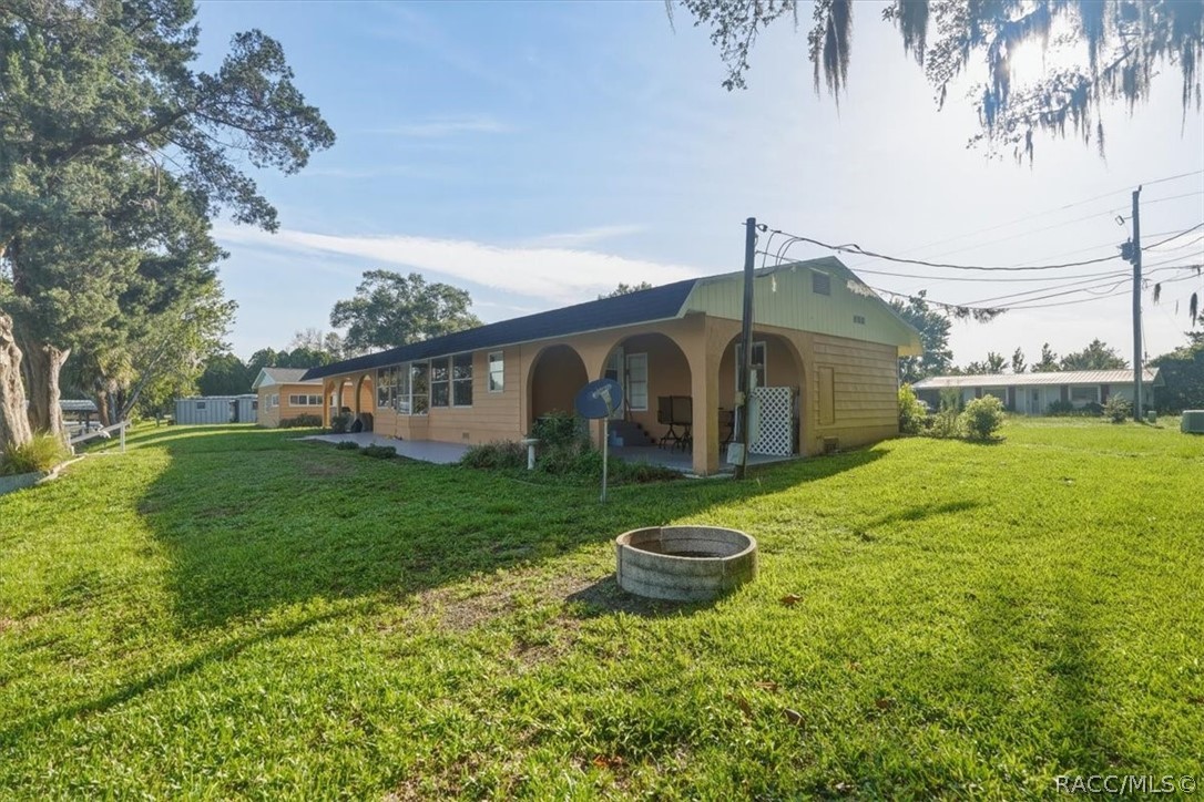 928 South Shad Terrace Inverness, FL 34450 - Photo 32 of 48 a view of a house with backyard and garden