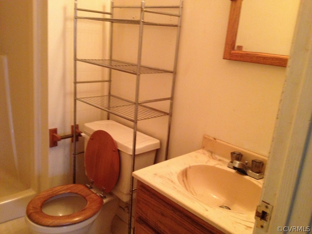 10531 Genlou Road Chesterfield, VA 23832 - Photo 12 of 17 a bathroom with a sink and a toilet