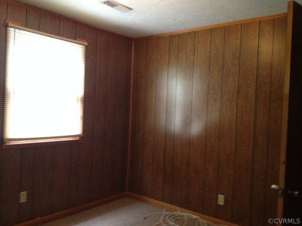 10531 Genlou Road Chesterfield, VA 23832 - Photo 13 of 17 a view of an empty room and wooden door