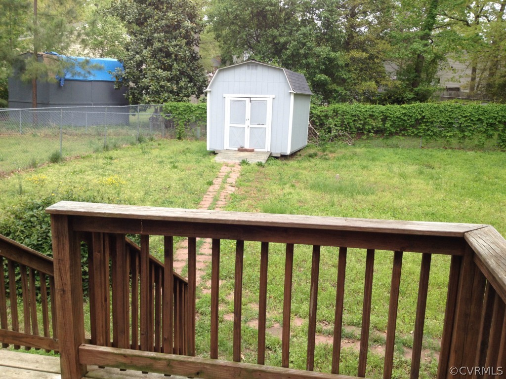 10531 Genlou Road Chesterfield, VA 23832 - Photo 16 of 17 a view of a small yard and large trees