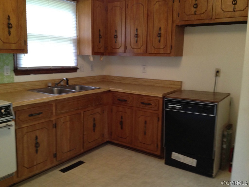 10531 Genlou Road Chesterfield, VA 23832 - Photo 4 of 17 a kitchen with granite countertop a sink cabinets and stainless steel appliances