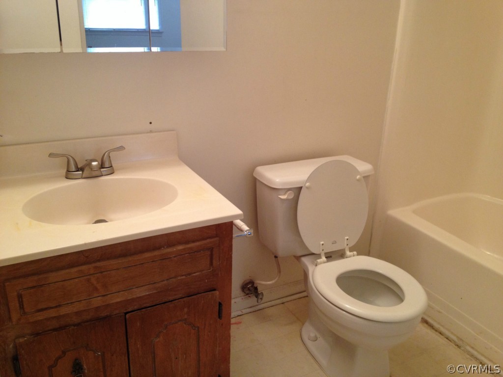 10531 Genlou Road Chesterfield, VA 23832 - Photo 6 of 17 a bathroom with a sink a toilet and bathtub