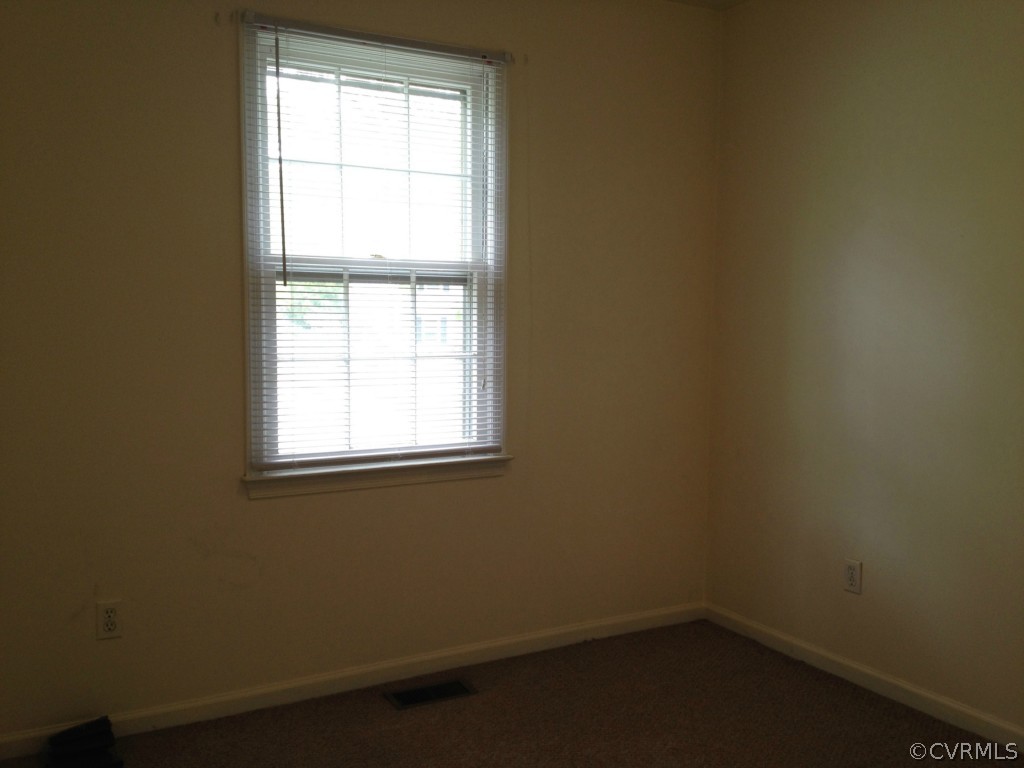 10531 Genlou Road Chesterfield, VA 23832 - Photo 10 of 17 an empty room with a window