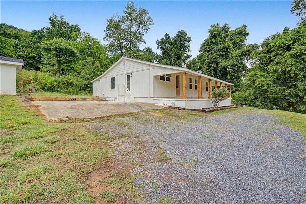 2115 King Road Dalton, GA 30720 - Photo 4 of 54 a house with trees in the background