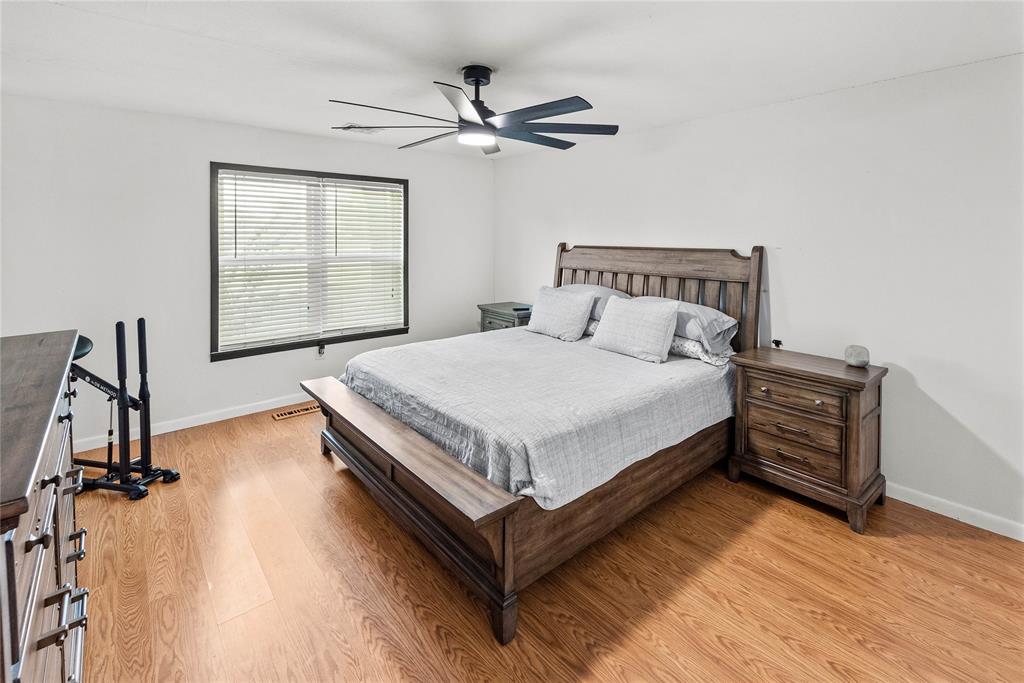 338 HCR 2124 Loop Whitney, TX 76692 - Photo 23 of 39 a bedroom with a bed and window
