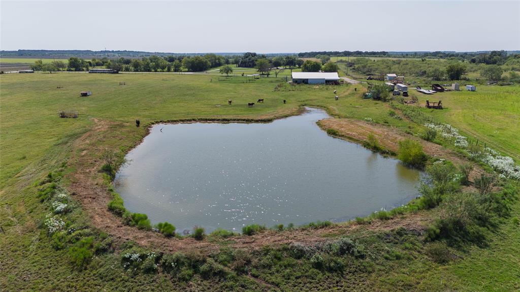 338 HCR 2124 Loop Whitney, TX 76692 - Photo 35 of 39 an aerial view of a house with a yard and lake view