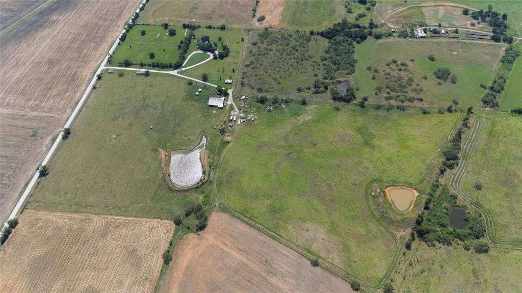 338 HCR 2124 Loop Whitney, TX 76692 - Photo 36 of 39 an aerial view of a house with a backyard