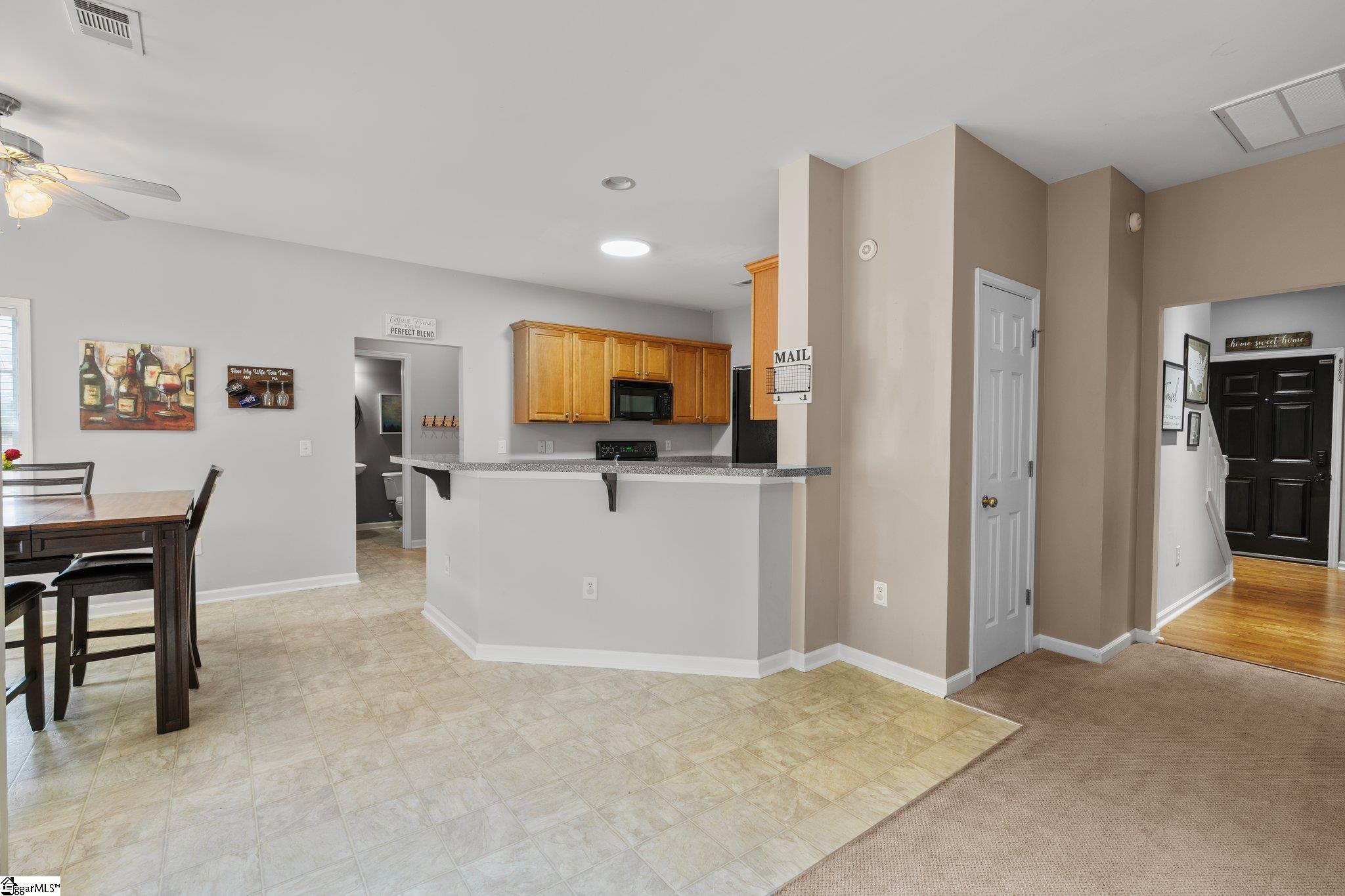 304 Grimes Drive Simpsonville, SC 29681 - Photo 12 of 36 Kitchen-eat in dining with view of front entry