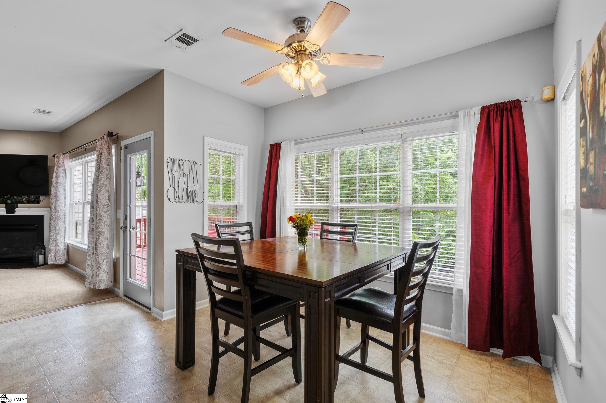 304 Grimes Drive Simpsonville, SC 29681 - Photo 14 of 36 Eat in Dining with view of Living room and yard