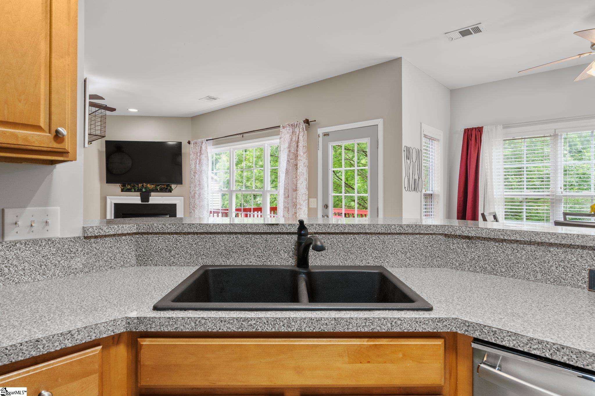 304 Grimes Drive Simpsonville, SC 29681 - Photo 18 of 36 Kitchen view to back door leading to deck