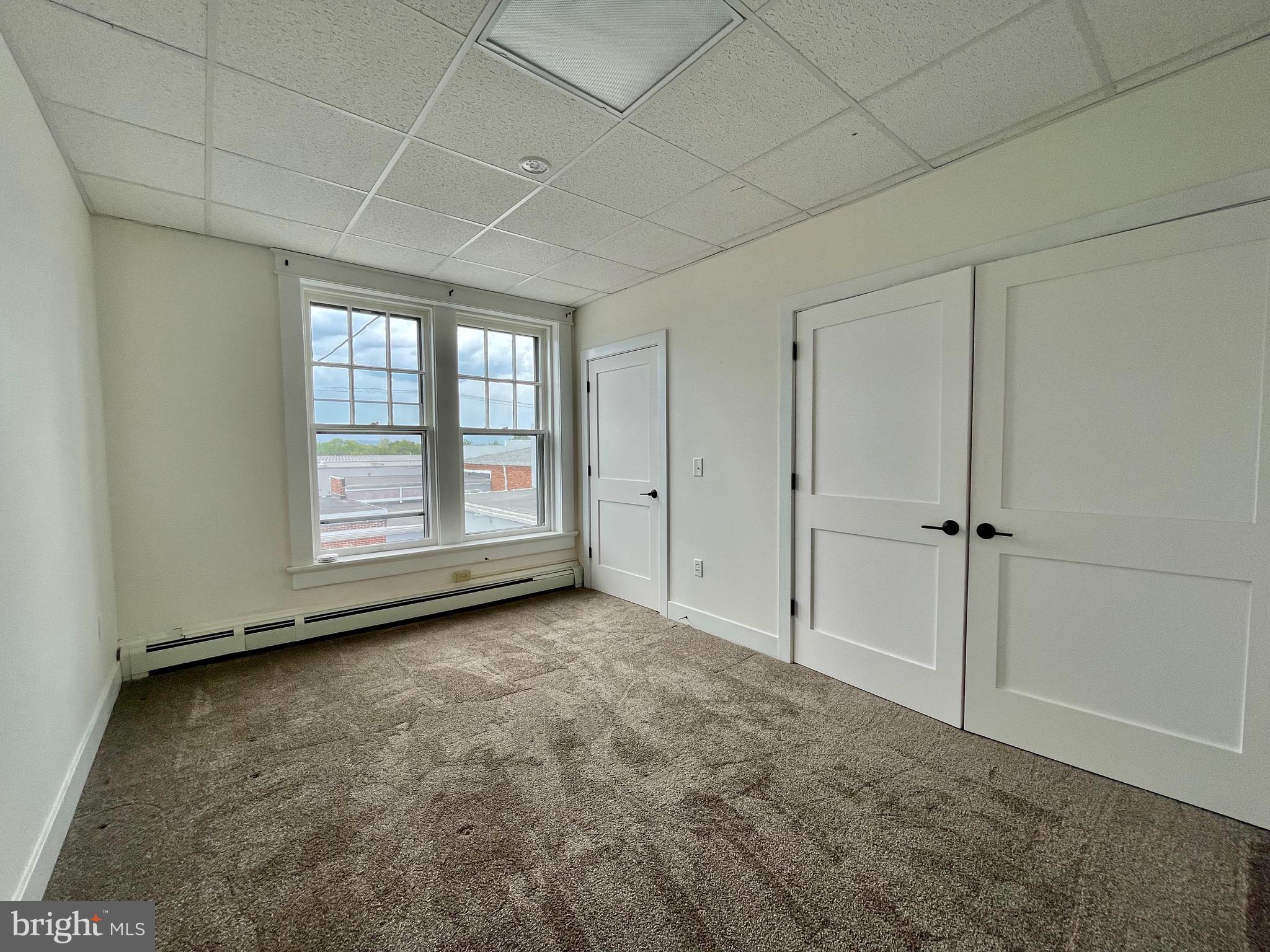 302 York Street, Unit 2 Gettysburg, PA 17325 - Photo 13 of 16 an empty room with windows