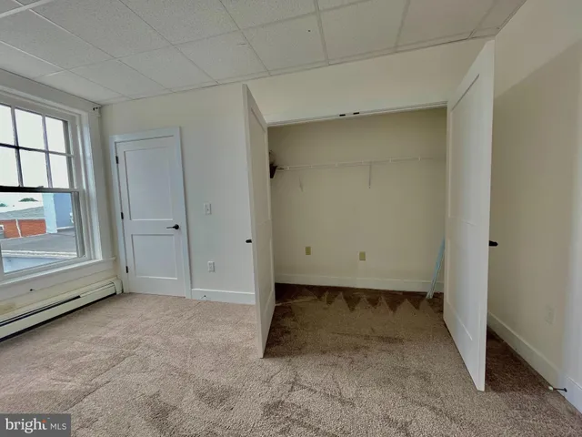 a view of a brick house with a yard