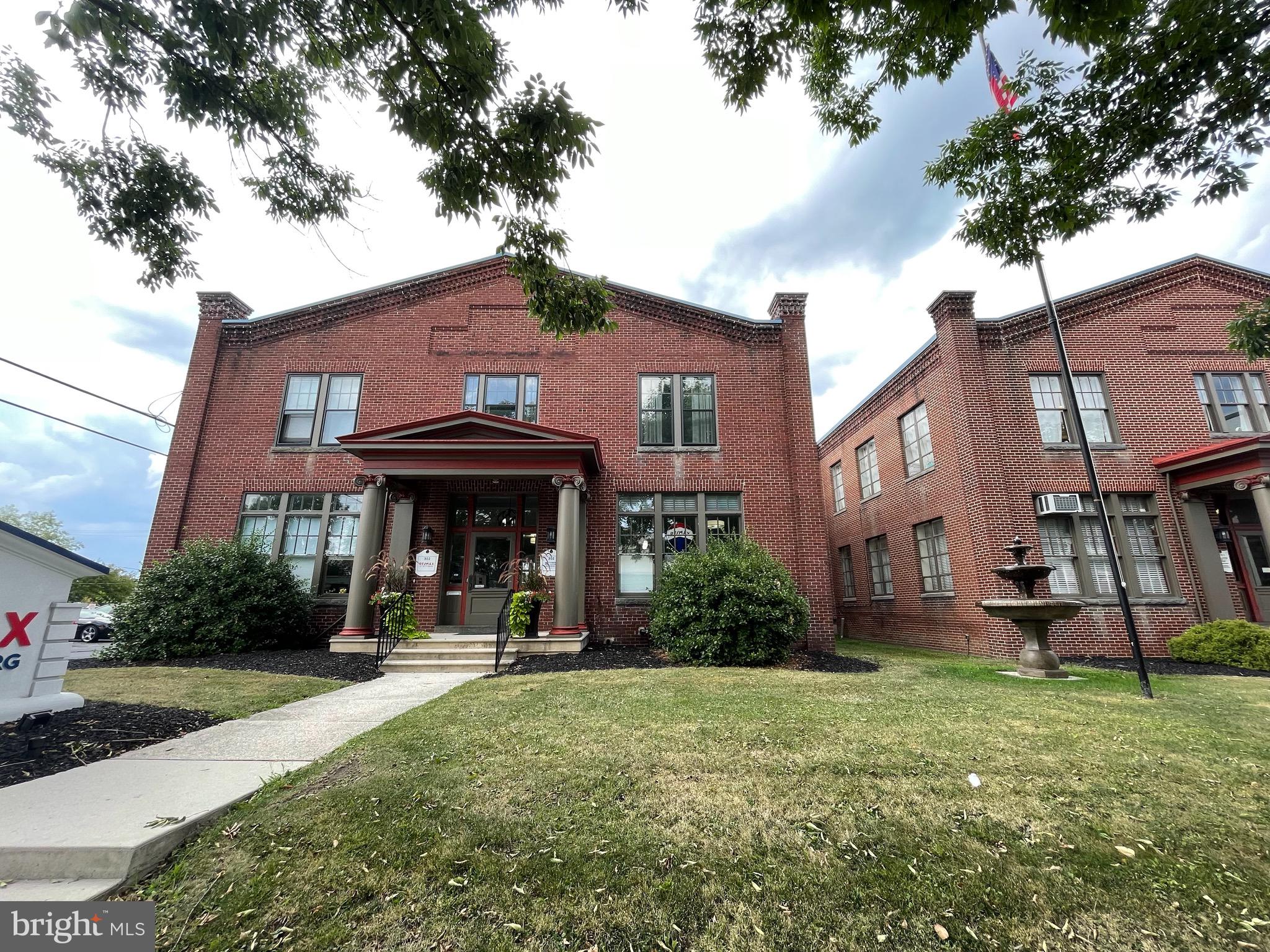302 York Street, Unit 2 Gettysburg, PA 17325 - Photo 15 of 16 a view of a brick house with a yard