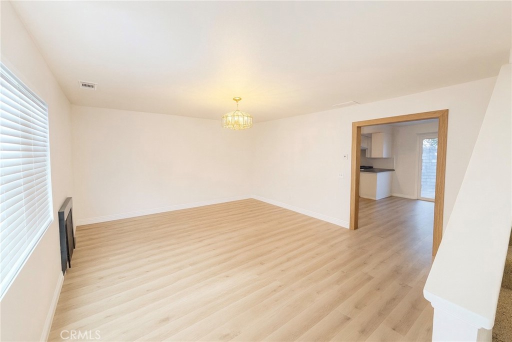 44628 La Paz Road Temecula, CA 92592 - Photo 1 of 14 a view of empty room with wooden floor