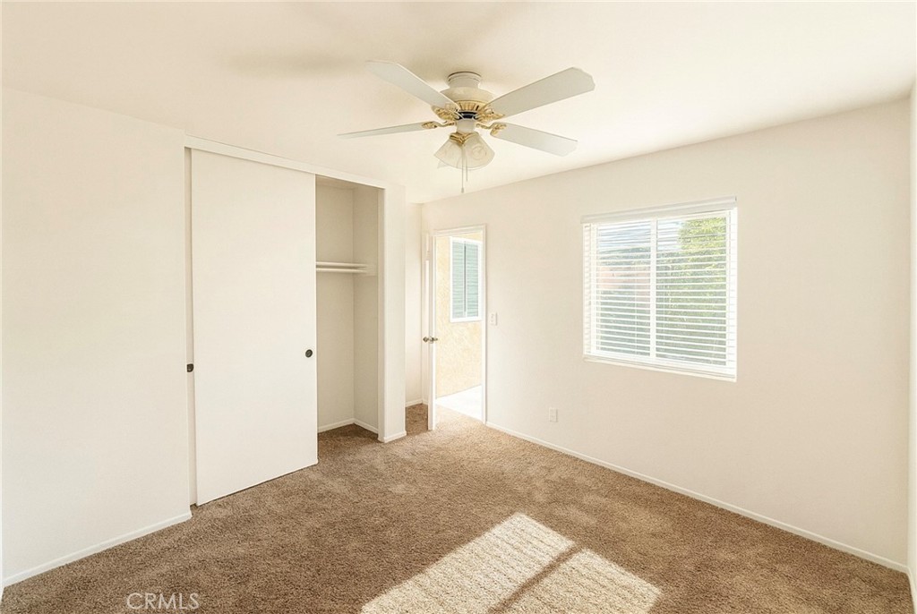 44628 La Paz Road Temecula, CA 92592 - Photo 9 of 14 a view of a livingroom with a ceiling fan and window