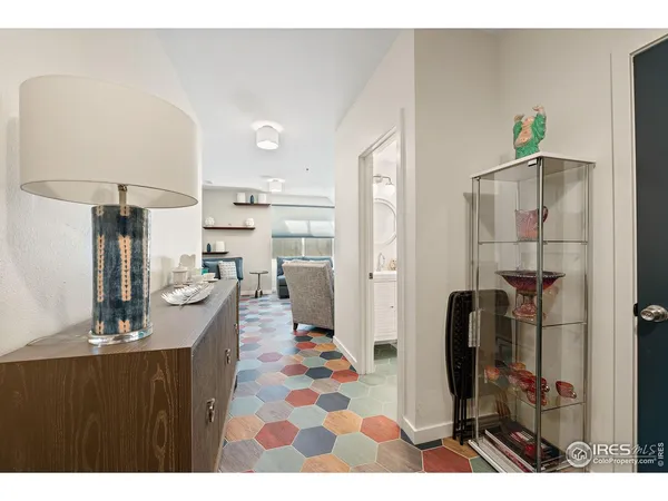 a dining room with furniture and a kitchen view