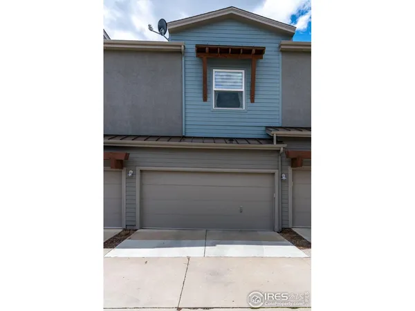 a brick building with a door and a door