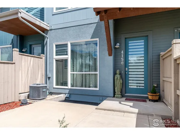 a backyard of a house with yard and glass doors