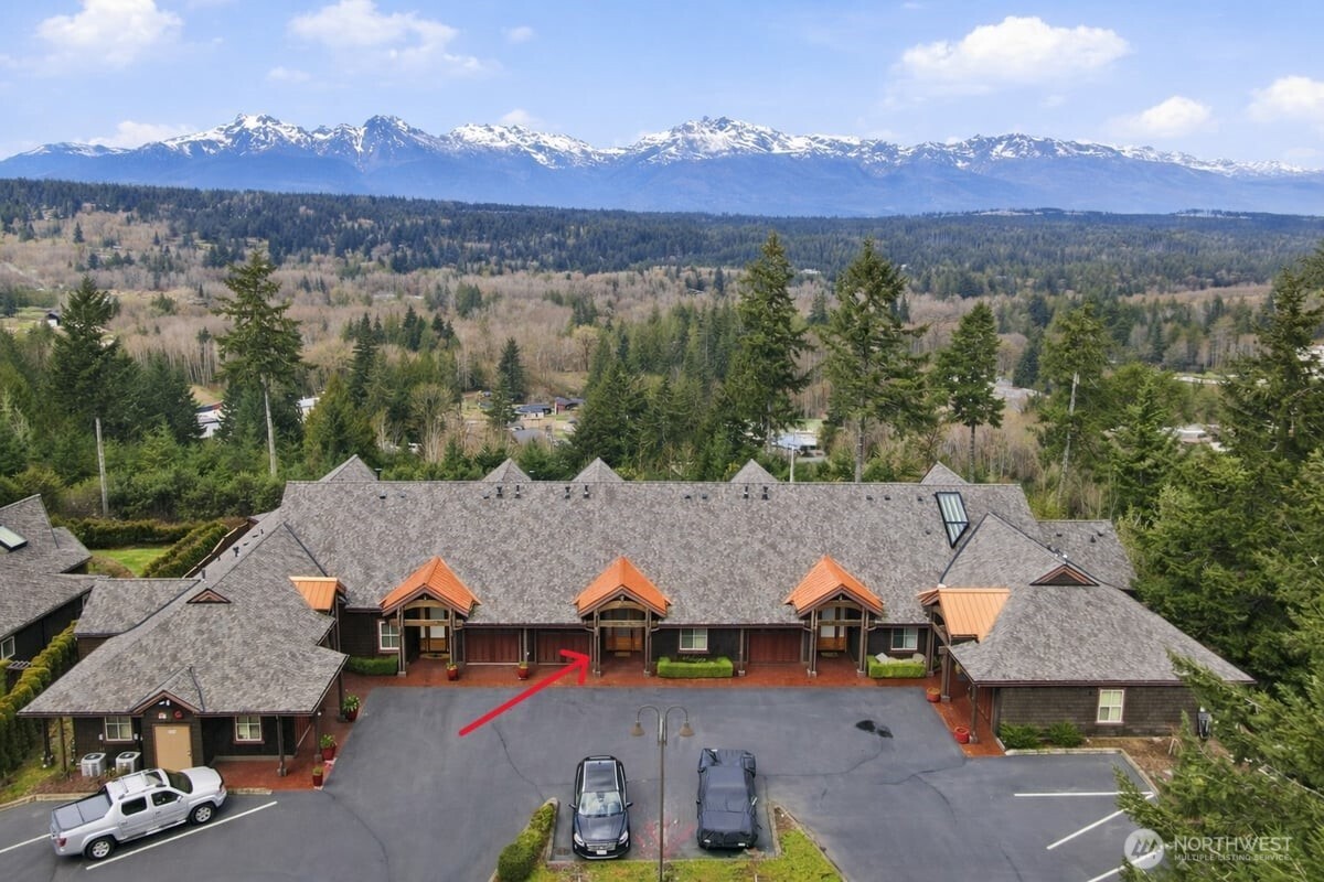 383 Romance Hill Road, Unit C Belfair, WA 98528 - Photo 21 of 25 an aerial view of a houses with a yard