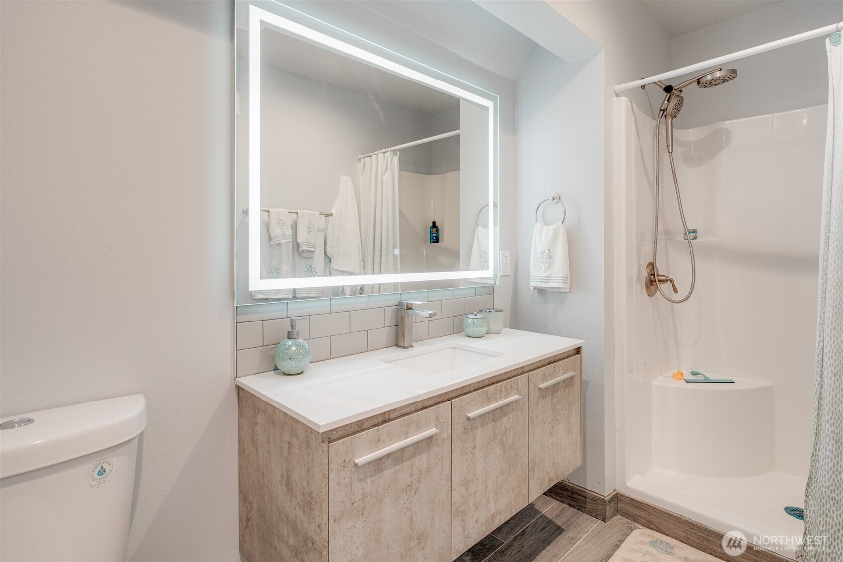5341 South Bercot Road Freeland, WA 98249 - Photo 26 of 37 a bathroom with a sink toilet vanity and shower