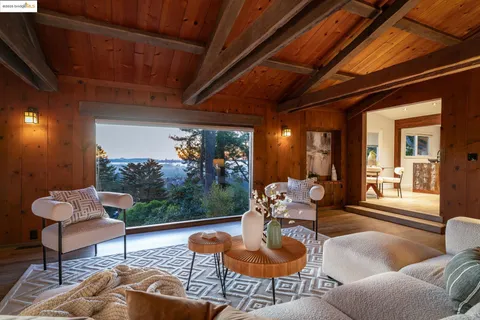 a dining room with furniture and wooden floor