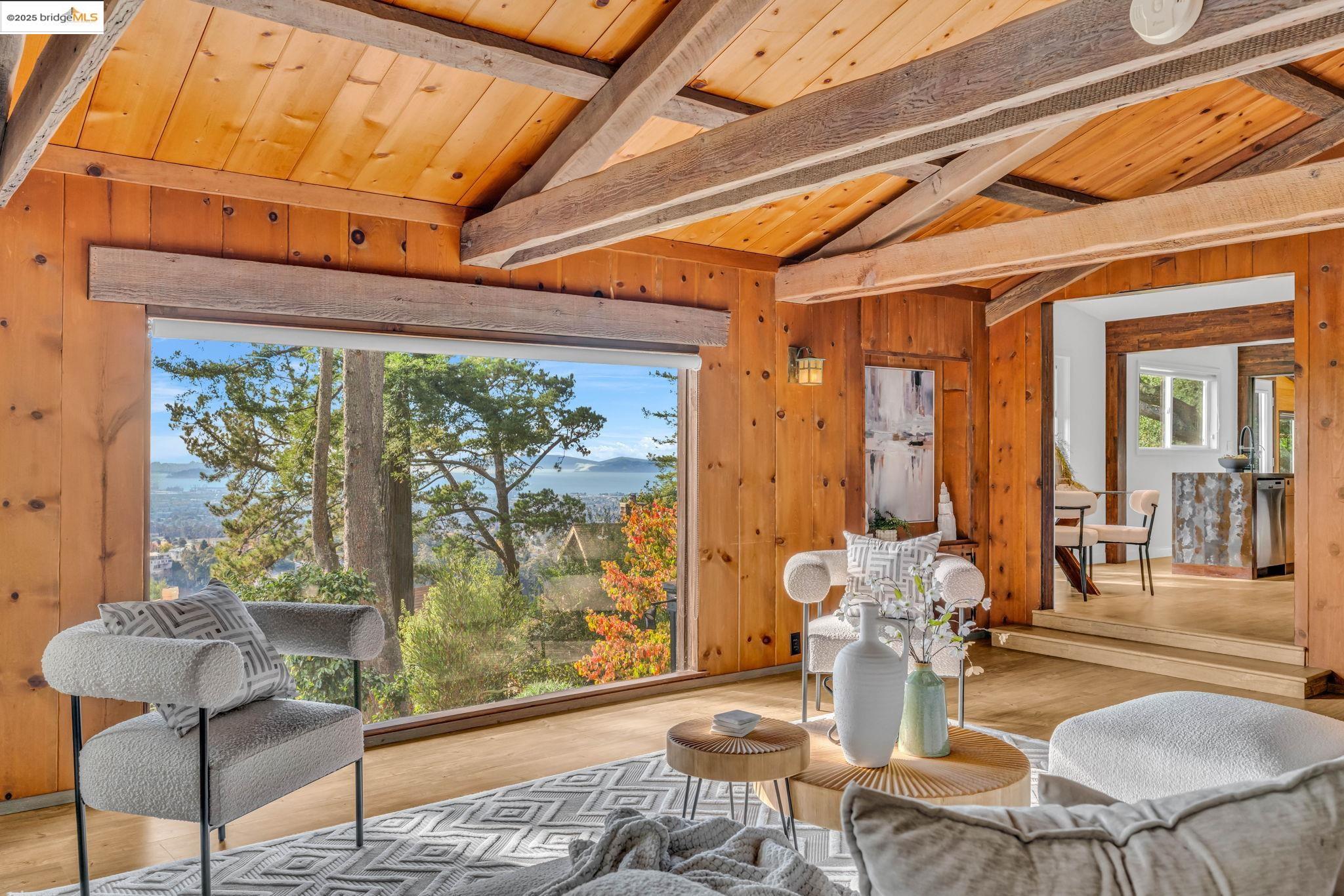 6141 Merriewood Drive Oakland, CA 94611 - Photo 14 of 58 a dining room with furniture and wooden floor