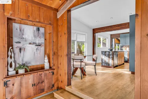 a kitchen with stainless steel appliances granite countertop a refrigerator and a stove