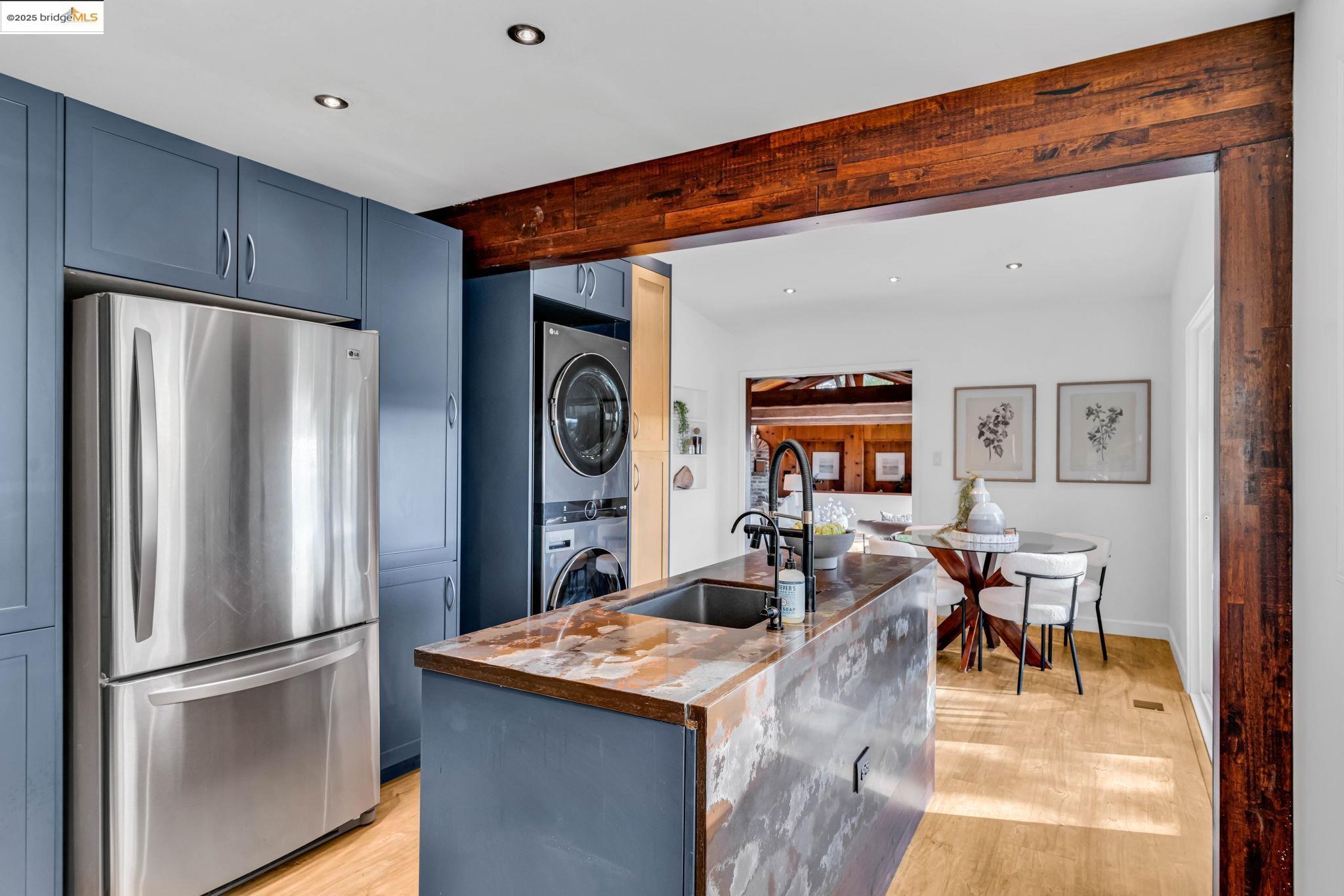 6141 Merriewood Drive Oakland, CA 94611 - Photo 19 of 58 a kitchen with stainless steel appliances granite countertop a refrigerator and a stove