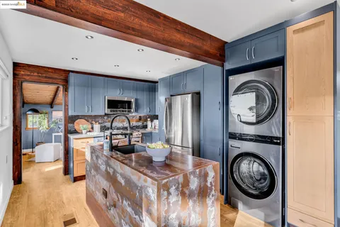 a bedroom with a bed and large window