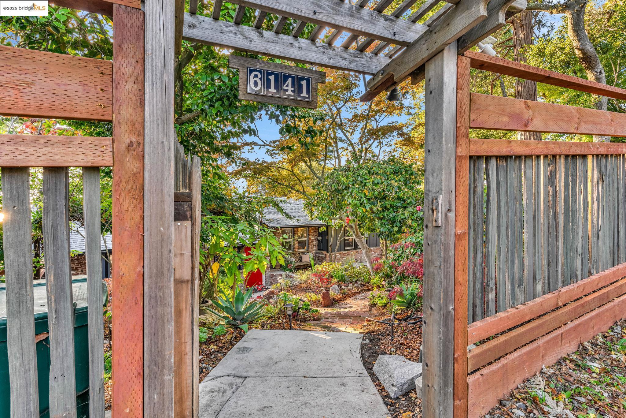 6141 Merriewood Drive Oakland, CA 94611 - Photo 2 of 58 a sign that is on the side of the road