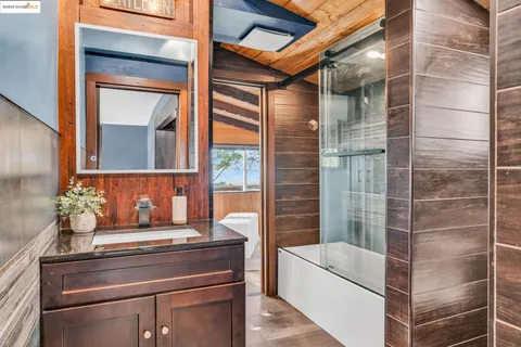 a dining room with a table and chairs