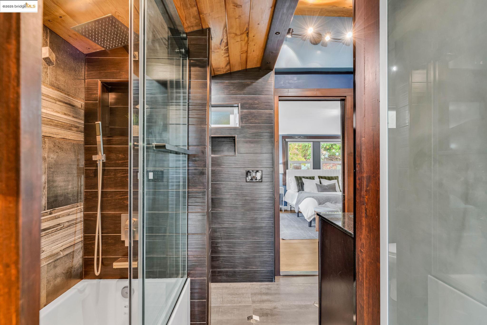 6141 Merriewood Drive Oakland, CA 94611 - Photo 27 of 58 a bathroom with a shower