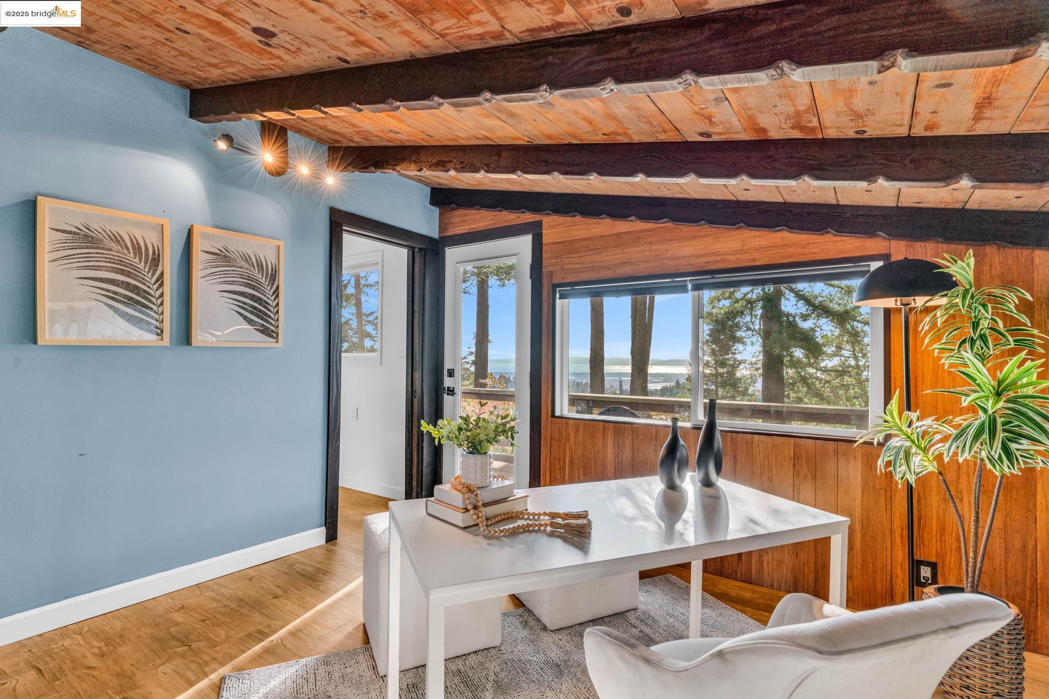 6141 Merriewood Drive Oakland, CA 94611 - Photo 29 of 58 a dining room with a table and chairs