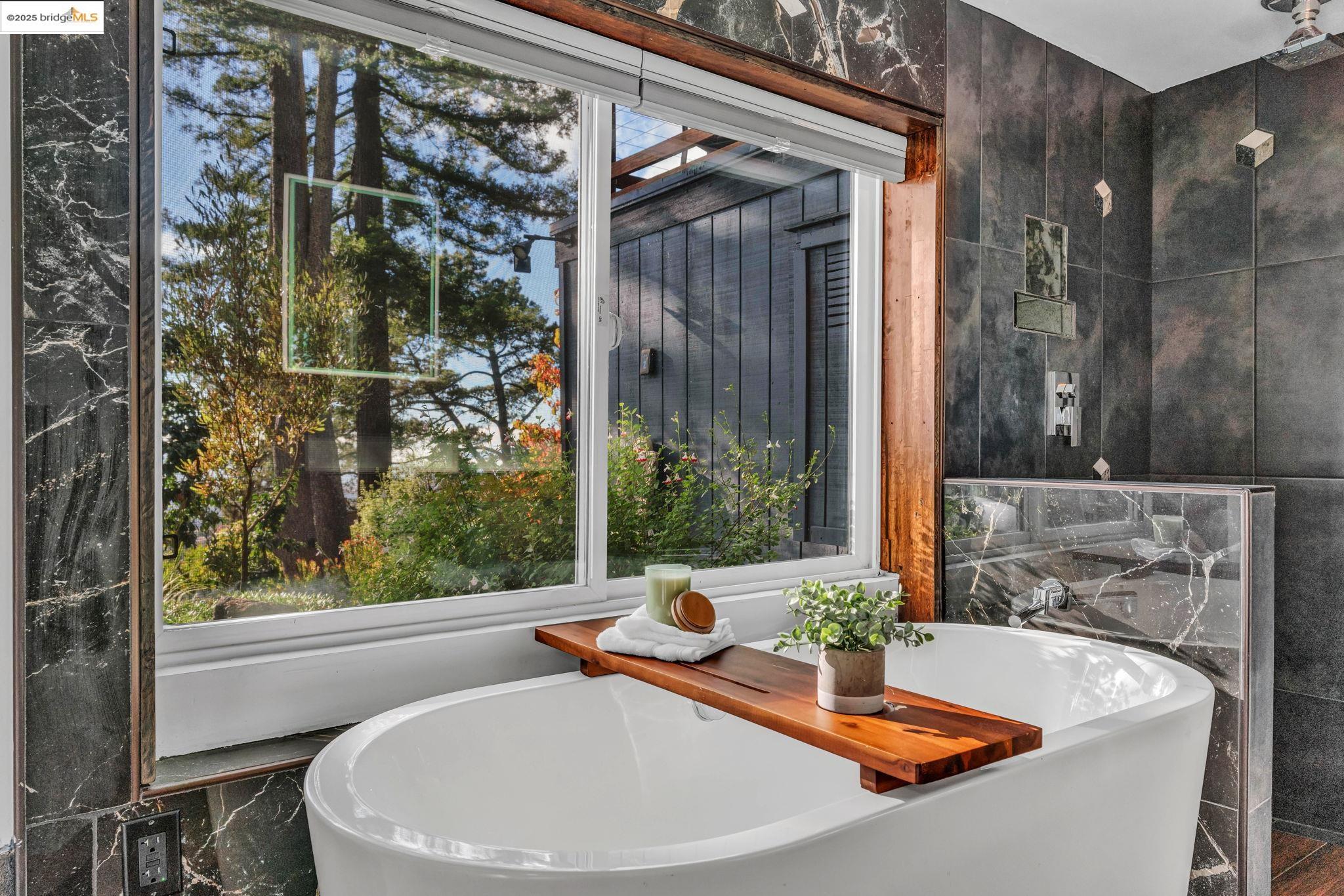 6141 Merriewood Drive Oakland, CA 94611 - Photo 34 of 58 a view of a bathroom with a tub and sink