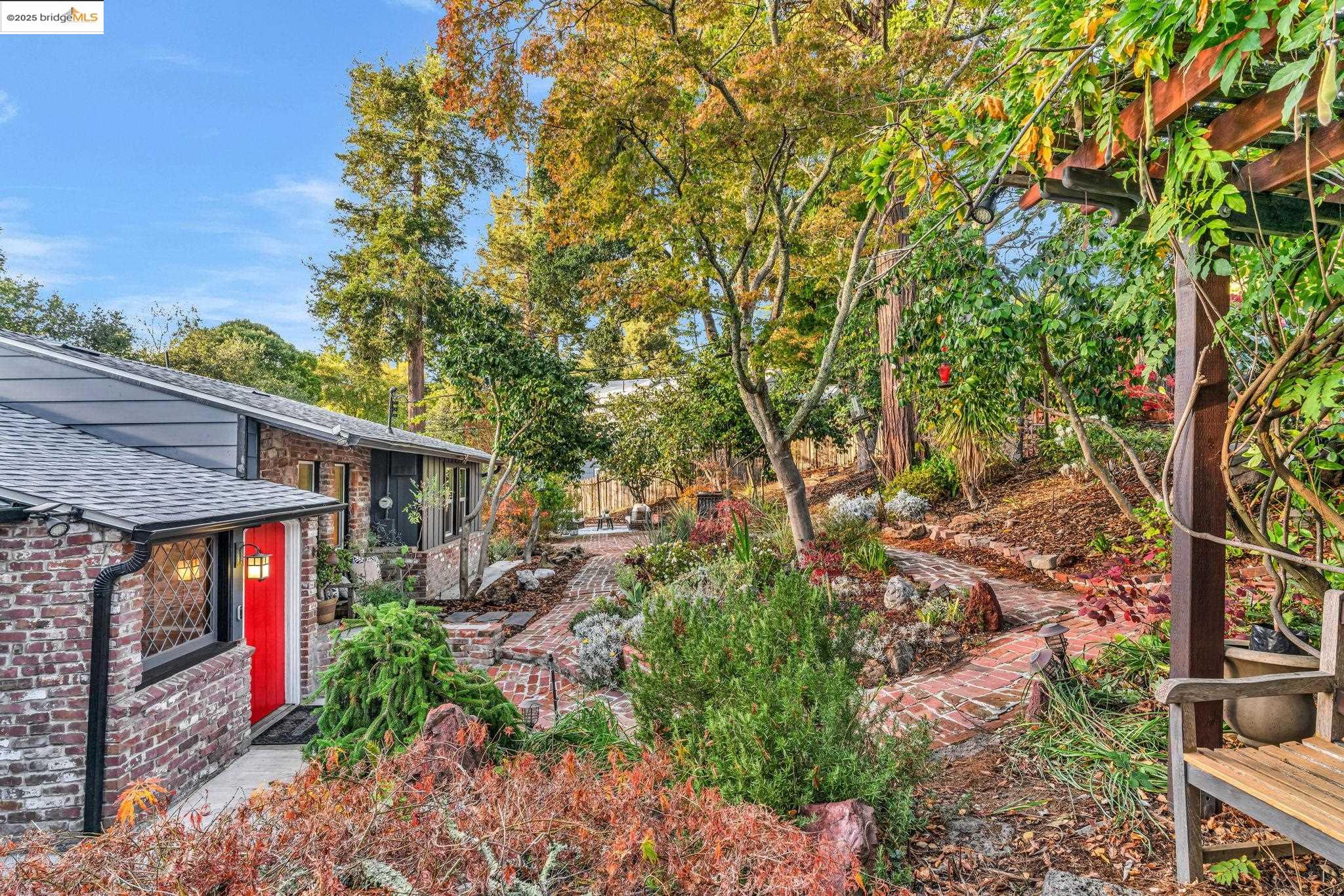 6141 Merriewood Drive Oakland, CA 94611 - Photo 4 of 58 a backyard of a house with lots of green space