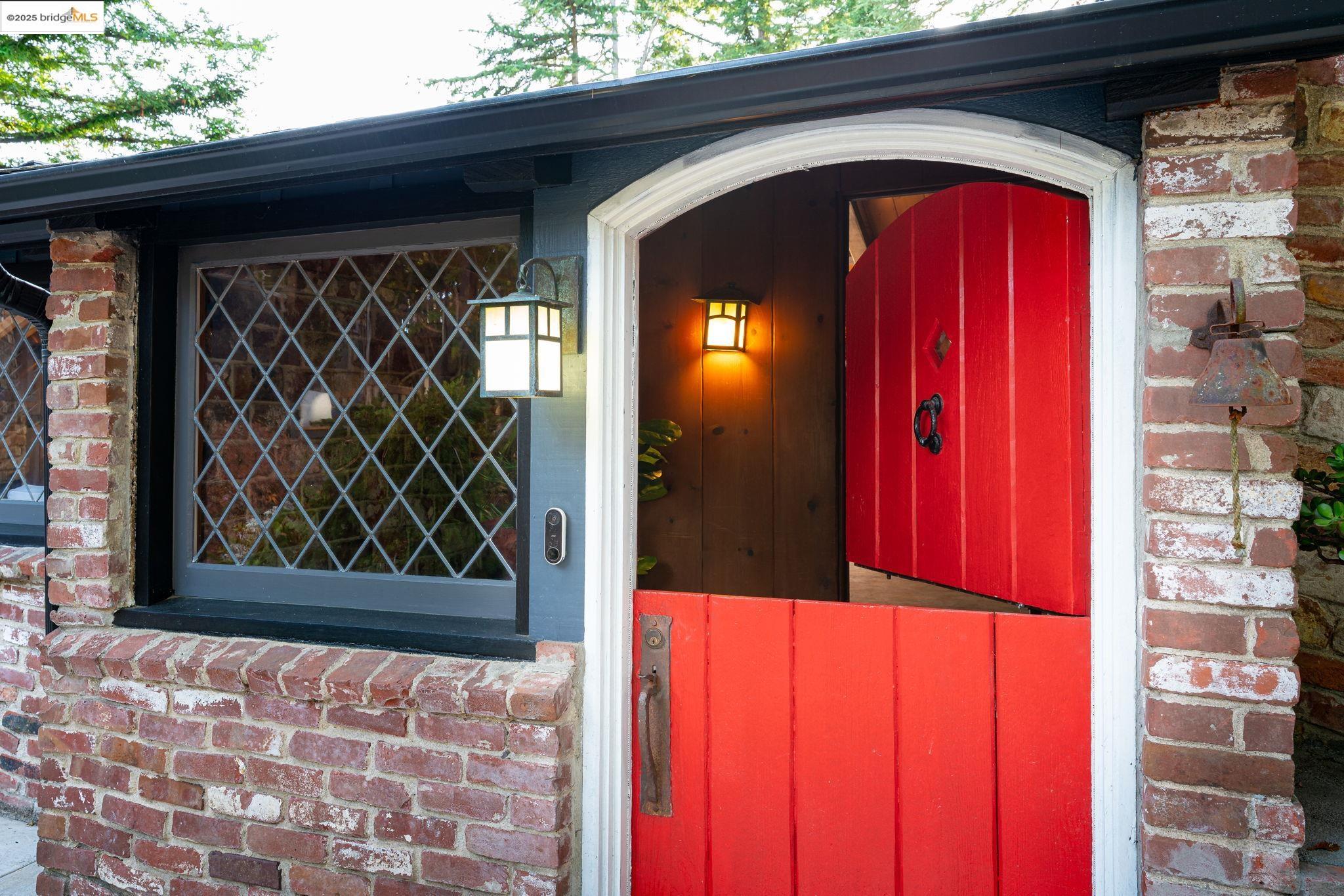 6141 Merriewood Drive Oakland, CA 94611 - Photo 6 of 58 Doorway to property with brick siding