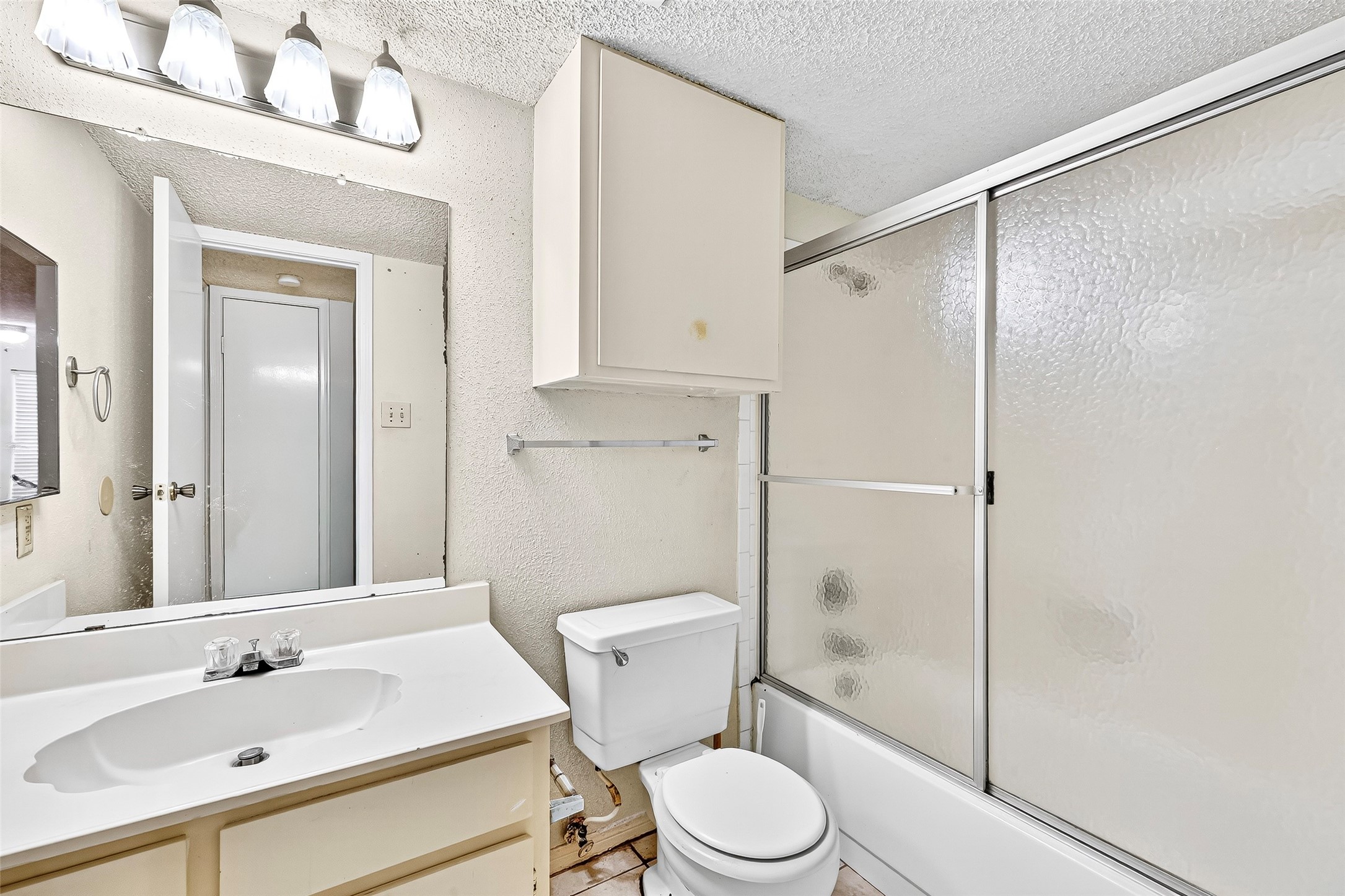 1515 Sandy Springs Road, Unit 3001 Houston, TX 77042 - Photo 14 of 28 a bathroom with a sink a toilet and shower